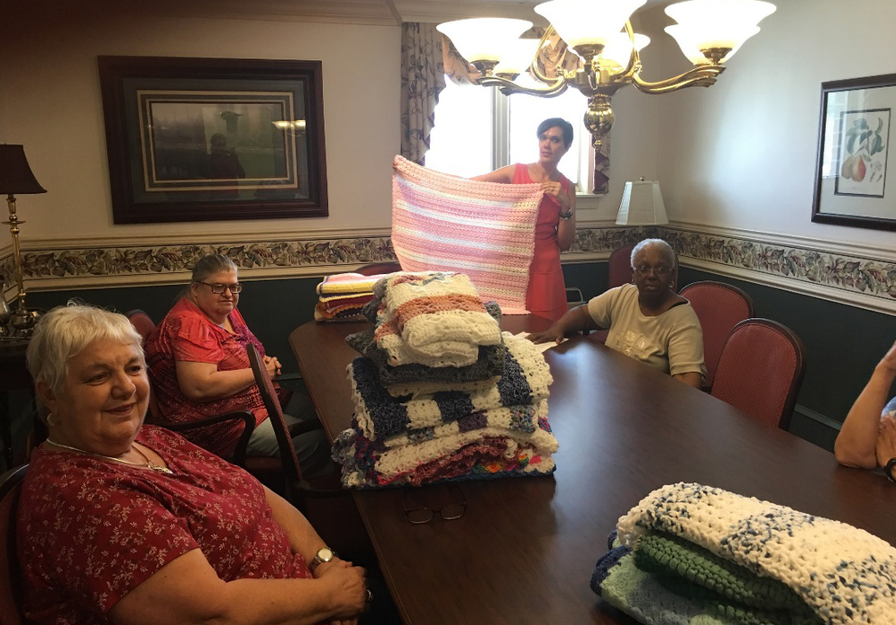 A group of people sitting around a table.