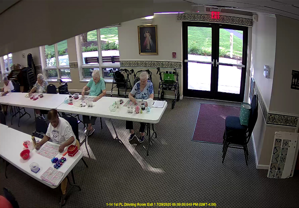 A group of people sitting at tables in a room.